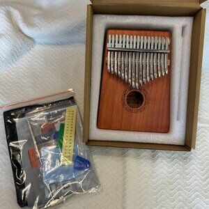 Kalimba Thumb Piano with assessories. Model W-17T. New. (1058)